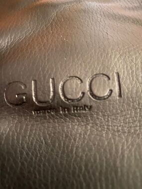 GUCCI black leather hobo handbag. Made in Italy with logo on the front.